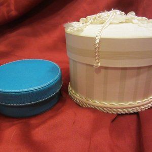DECORATIVE BOXES, ONE BLUE FAUX LEATHER, ONE CREAM CLOTH & RIBBONS